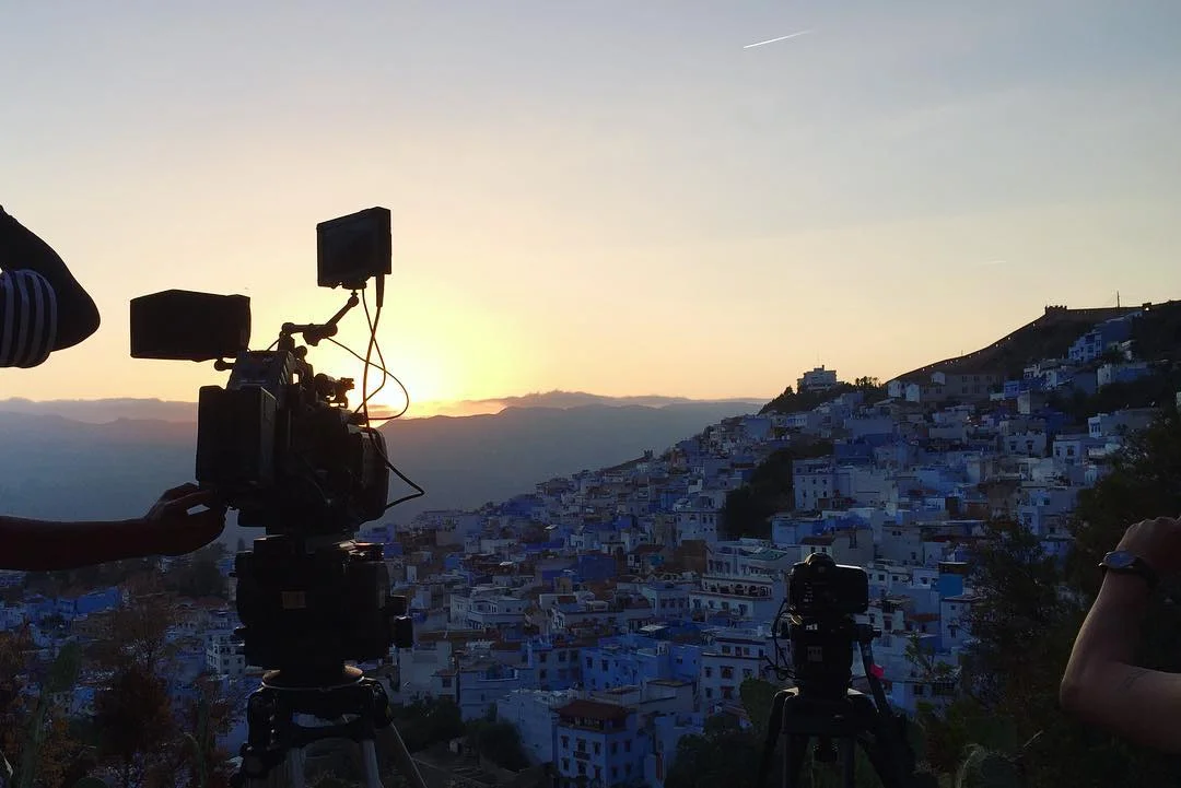 Cameras on tripods overlooking Chefchaouen at sunset during the Samsung QLED production